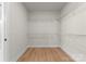 Empty walk-in closet with wood floors and wire shelving at 199 Heartland Dr # 10, Rock Hill, SC 29732