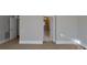 A hallway featuring carpet, doors, and white walls at 3727 Mooreland Farms Rd, Charlotte, NC 28226