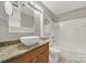 Bathroom featuring a vessel sink, granite countertop, and tiled shower/tub combo at 529 Graham St # 1F, Charlotte, NC 28202