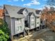 Modern condo building features three stories with neutral siding, balconies and covered parking at 529 Graham St # 1F, Charlotte, NC 28202