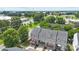 Aerial view of townhouses with well-maintained lawns and a canopy of lush, mature trees at 9341 Lenox Pointe Dr, Charlotte, NC 28273