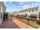 Spacious wooden deck overlooking a well-maintained backyard and neighboring townhome exteriors at 9341 Lenox Pointe Dr, Charlotte, NC 28273