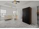Bright bedroom with a crib, large closet, and ample natural light at 9341 Lenox Pointe Dr, Charlotte, NC 28273