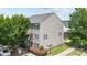 Exterior of a townhouse featuring manicured landscaping and a prominent street sign at 9341 Lenox Pointe Dr, Charlotte, NC 28273
