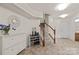 Bright foyer with staircase, featuring tile flooring and a modern decor at 9341 Lenox Pointe Dr, Charlotte, NC 28273