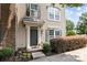 Inviting front entrance with elegant door, stylish accents, and well-maintained landscaping at 9341 Lenox Pointe Dr, Charlotte, NC 28273
