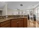Bright kitchen featuring granite countertops, stainless steel sink, and hardwood floors at 9341 Lenox Pointe Dr, Charlotte, NC 28273
