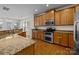Spacious kitchen with granite countertops, stainless steel appliances, and hardwood floors at 9341 Lenox Pointe Dr, Charlotte, NC 28273