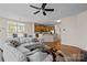 Open-concept living space with hardwood floors connecting the kitchen and living areas at 9341 Lenox Pointe Dr, Charlotte, NC 28273