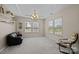 Well-lit living room with large windows, neutral walls, and modern decor accents at 9341 Lenox Pointe Dr, Charlotte, NC 28273