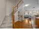 Inviting staircase leading to the upper level, adjacent to a bright living area at 9341 Lenox Pointe Dr, Charlotte, NC 28273