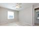 Neutral bedroom with a ceiling fan, window, and carpeted flooring at 430 Queens Rd # 712, Charlotte, NC 28207