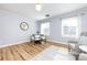 Sunlit dining area with hardwood floors, round table, and stylish decor at 430 Queens Rd # 712, Charlotte, NC 28207