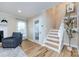 Inviting living room with hardwood floors, fireplace, and a staircase leading to the upper level at 430 Queens Rd # 712, Charlotte, NC 28207