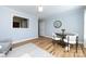 Sunlit dining area with hardwood floors, round table, and stylish decor at 430 Queens Rd # 712, Charlotte, NC 28207