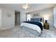 Spacious main bedroom with a ceiling fan, a walk-in closet, and a geometric patterned rug at 430 Queens Rd # 712, Charlotte, NC 28207