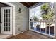 Covered porch with wood flooring and siding, offering a relaxing outdoor space at 430 Queens Rd # 712, Charlotte, NC 28207