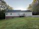 Home's back features a deck and spacious yard at 475 Cornerstone Dr, Taylorsville, NC 28681