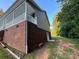 Side view of home showcasing porch and brick at 475 Cornerstone Dr, Taylorsville, NC 28681