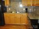 Kitchen corner sink and wood cabinets at 475 Cornerstone Dr, Taylorsville, NC 28681