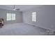 Spacious bedroom with neutral walls and ceiling fan at 125 Ariel Dr, Mooresville, NC 28117