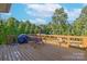 Deck overlooking wooded backyard with seating at 125 Ariel Dr, Mooresville, NC 28117