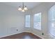 Bright dining area with large windows and wood flooring at 125 Ariel Dr, Mooresville, NC 28117