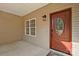 Red front door with glass accents and a small porch at 125 Ariel Dr, Mooresville, NC 28117