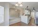 Open kitchen features granite countertops and white cabinets at 125 Ariel Dr, Mooresville, NC 28117