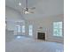 Living room with fireplace, vaulted ceiling and access to deck at 125 Ariel Dr, Mooresville, NC 28117