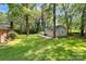 Spacious backyard with detached workshop and lush greenery at 1801 Windsor Dr, Lancaster, SC 29720