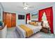 Bedroom with a bed, dresser, and red curtains at 1801 Windsor Dr, Lancaster, SC 29720