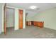 Unfinished bonus room with wood cabinets and carpet at 1801 Windsor Dr, Lancaster, SC 29720