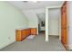 Unfinished bonus room with wood cabinets and carpet at 1801 Windsor Dr, Lancaster, SC 29720