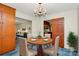 Bright dining area with a round table, chandelier, and built-in hutch at 1801 Windsor Dr, Lancaster, SC 29720