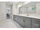 Modern bathroom featuring double sinks with gray cabinetry and a large mirror at 133 Jentri Way, Mooresville, NC 28115