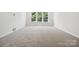 Neutral bedroom with large windows and carpet at 133 Jentri Way, Mooresville, NC 28115