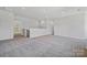 Spacious bonus room with neutral carpeting and paint, brightened by recessed lighting and a large window at 133 Jentri Way, Mooresville, NC 28115