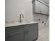 Laundry room with gray cabinets, a sink, and quartz countertops at 133 Jentri Way, Mooresville, NC 28115