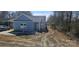 Charming light blue home with gray roof, manicured lawn, and inviting front entrance at 2280 Dale Earnhardt Blvd, Kannapolis, NC 28083
