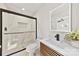 Modern bathroom with a large shower and floating vanity at 2600 Alleghany St, Charlotte, NC 28208