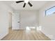 Bright bedroom with hardwood floors and ceiling fan at 2600 Alleghany St, Charlotte, NC 28208