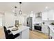 Modern white kitchen with stainless steel appliances at 2600 Alleghany St, Charlotte, NC 28208