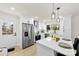 Modern white kitchen with island and stainless steel appliances at 2600 Alleghany St, Charlotte, NC 28208