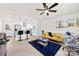 Open concept living area with kitchen, yellow couch, and rug at 2600 Alleghany St, Charlotte, NC 28208