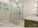 Bathroom with white subway tile shower and glass enclosure at 4301 Fairview Oaks Dr, Charlotte, NC 28211