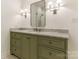 Bathroom with green vanity, marble countertop, and walk-in shower at 4301 Fairview Oaks Dr, Charlotte, NC 28211