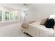 Bright bedroom featuring large bay windows, a cozy bed and a ceiling fan at 4301 Fairview Oaks Dr, Charlotte, NC 28211