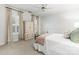 Bright bedroom featuring neutral walls, shuttered windows, carpeted floors and a bed with stylish decorative pillows at 4301 Fairview Oaks Dr, Charlotte, NC 28211