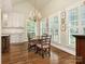 Charming breakfast nook with hardwood floors and window seating at 4301 Fairview Oaks Dr, Charlotte, NC 28211